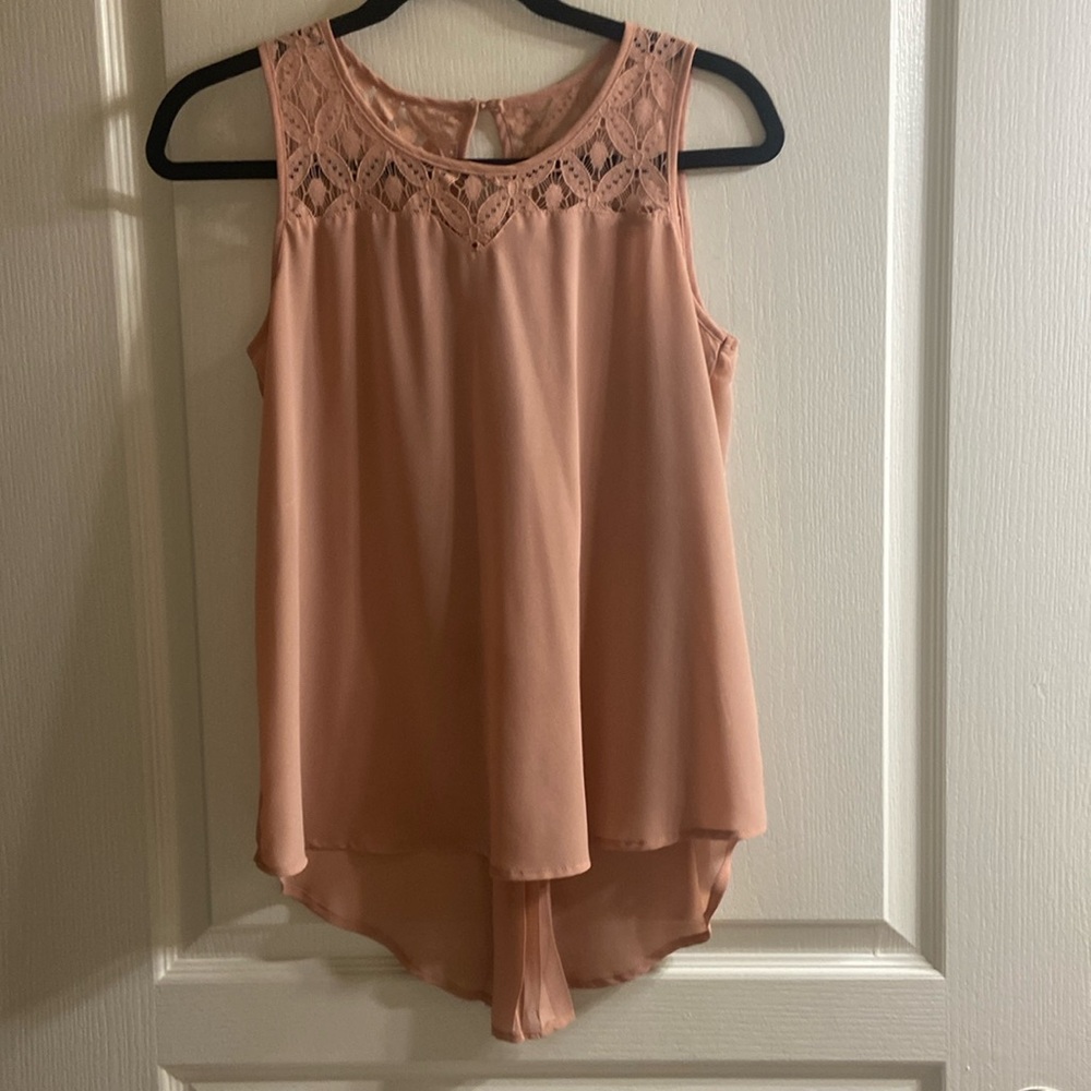 Tank blouse with lace like detail. A dark shade of nude/camel in color